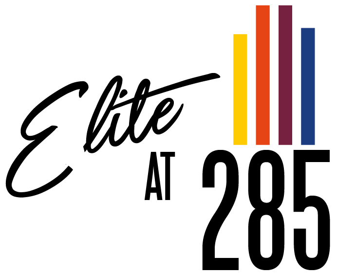 the life at 2026 logo with colorful stripes on a green background